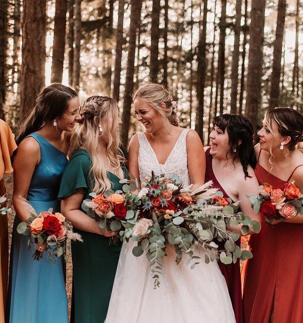 bridal party wearing colorful dresses