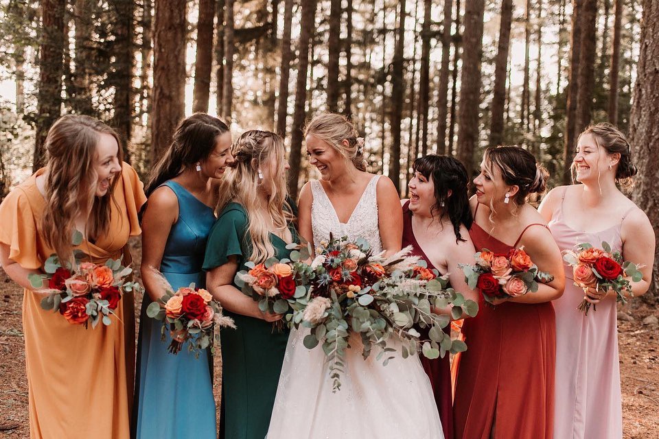 bridal party wearing colorful dresses