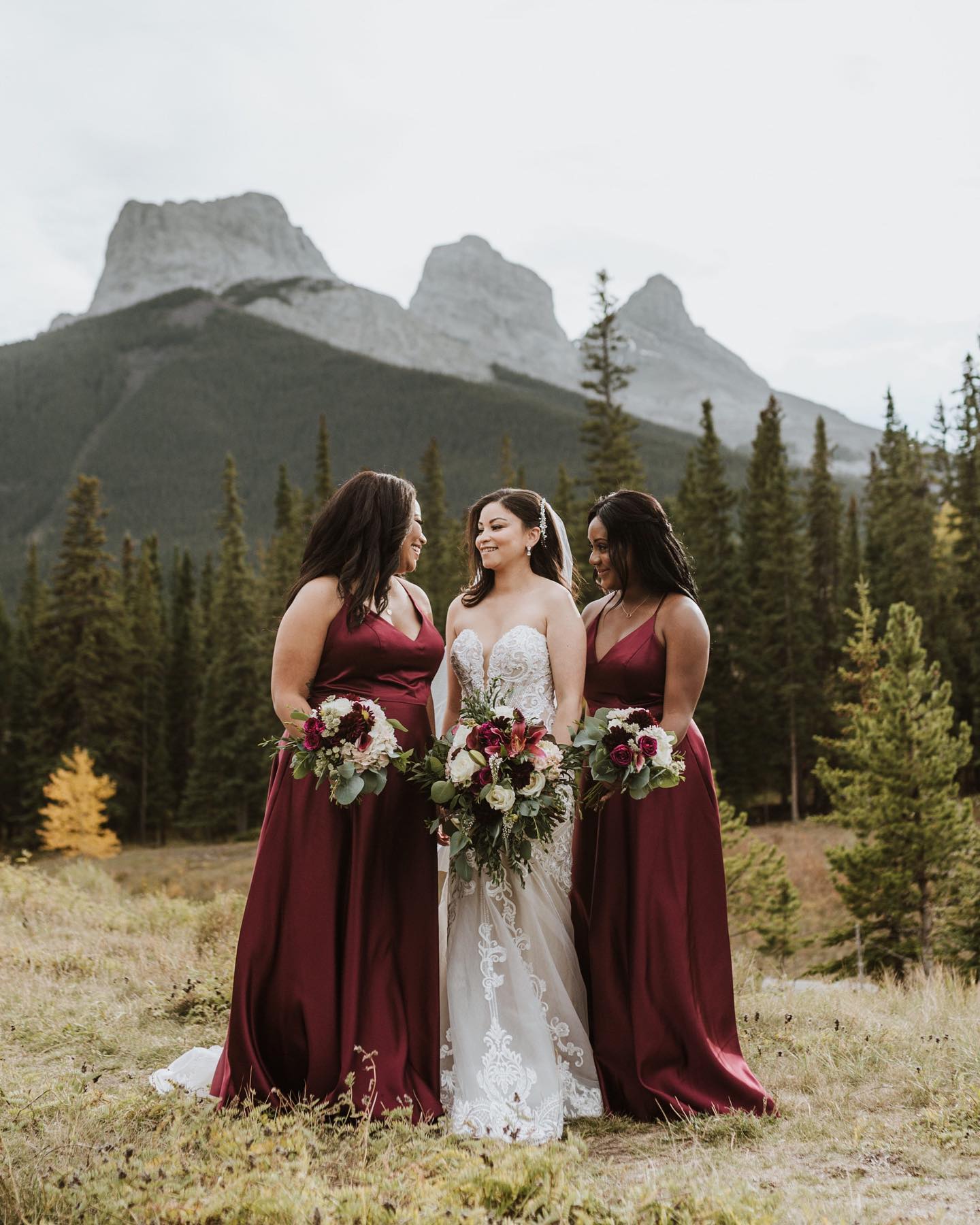 bridesmaids standing in the forest
