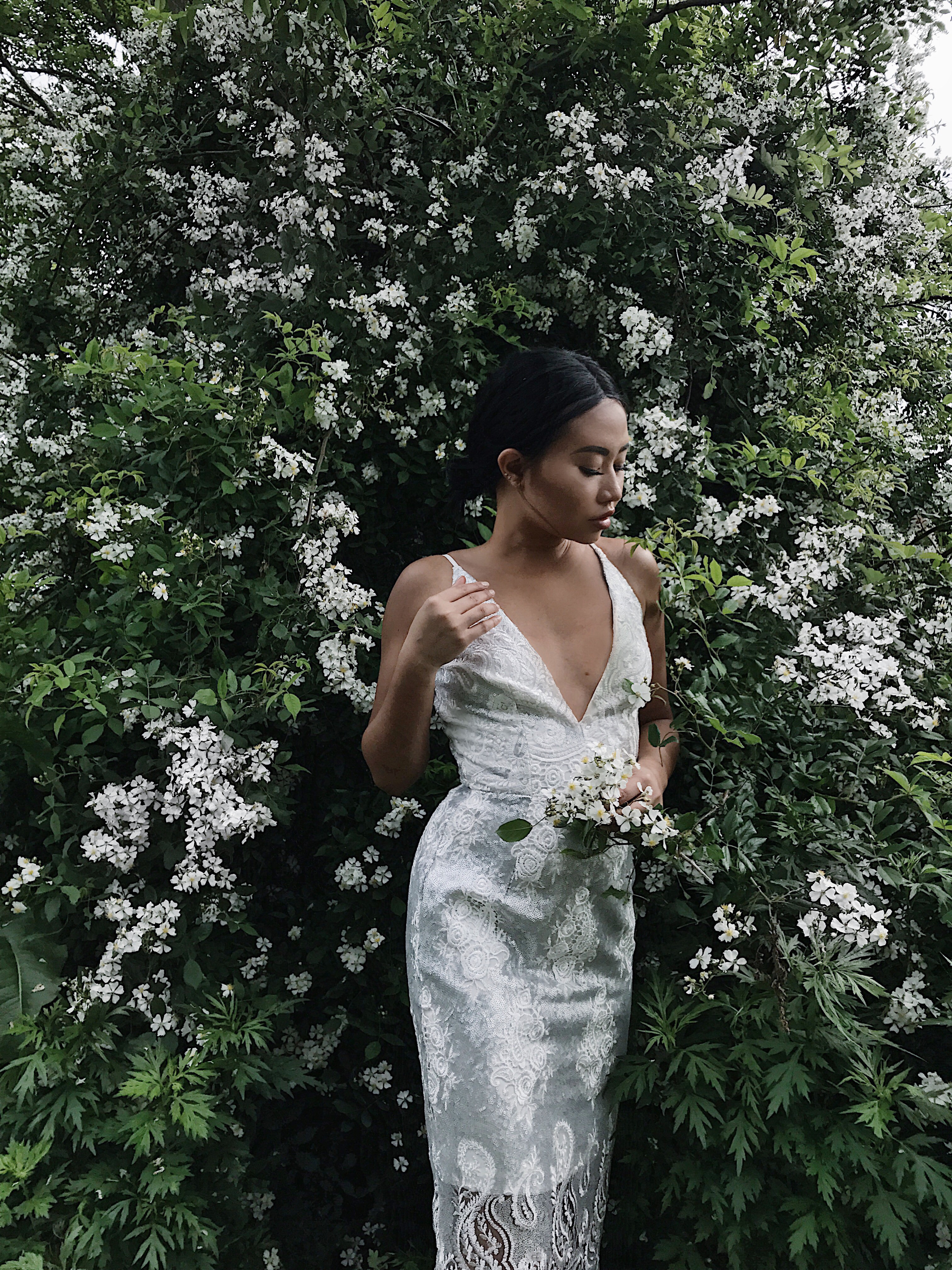 Blogger Jeanne of Grey Layers in a silvery lace sheath perfect for an engagement party. See more on the David's Bridal blog - www.daviddsbridal.com/blog.