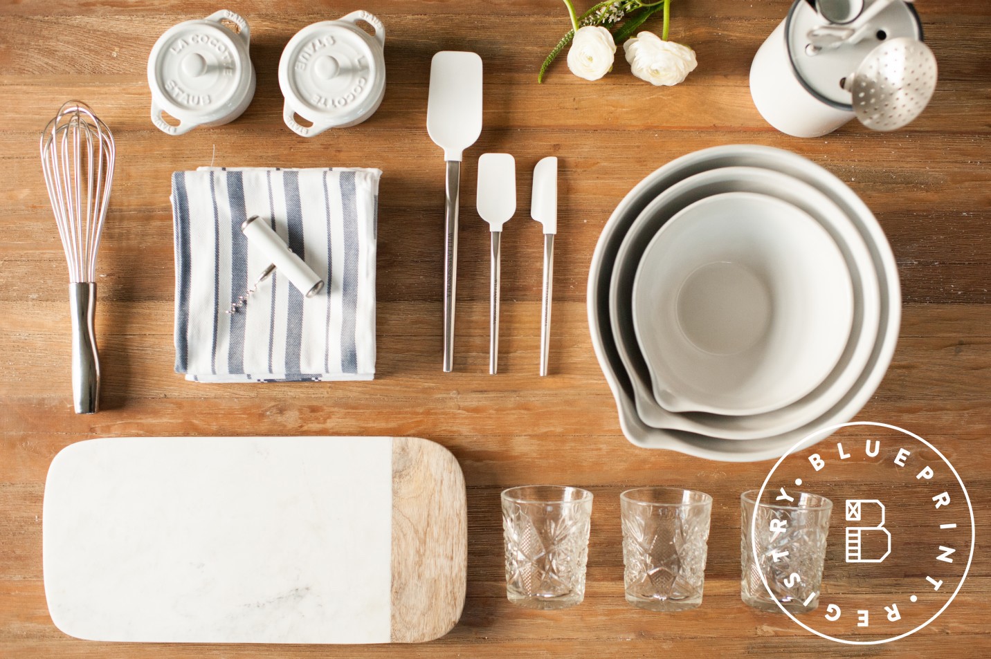 kitchen utensils and bowls on a wood table