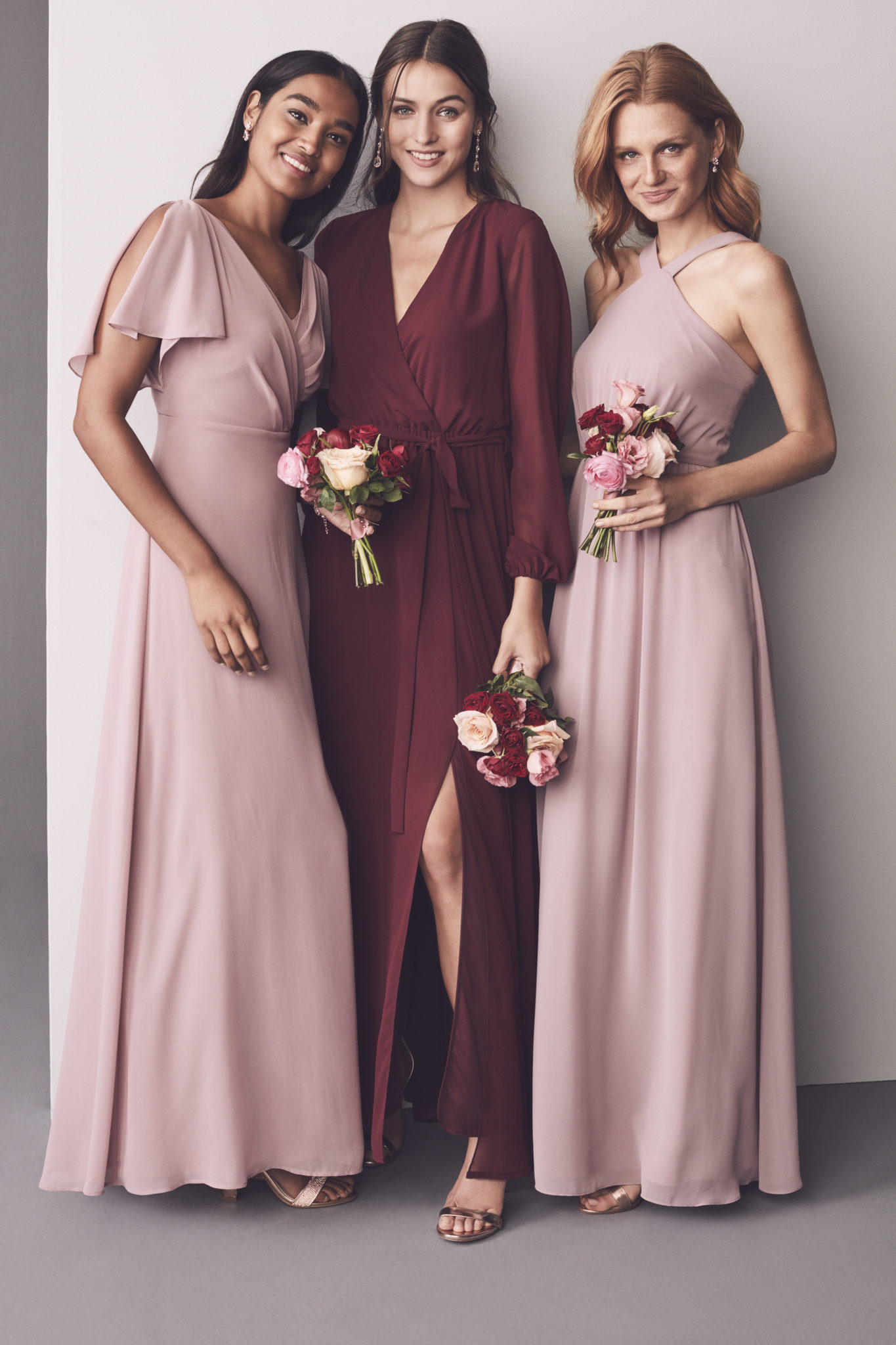Group of 3 bridesmaids in shades of pink and red