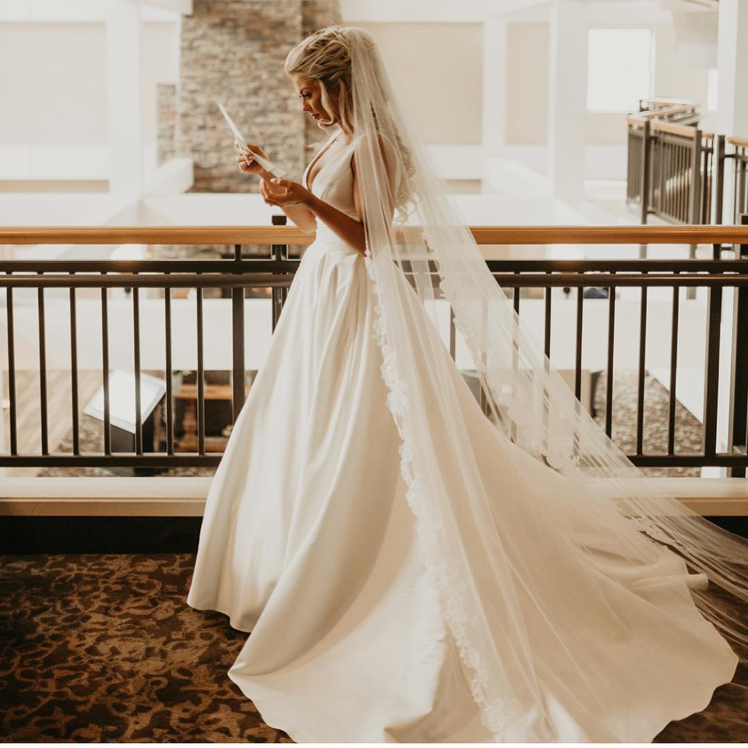 Bride in white dress and cathedral length veil | | Insta-Worthy Veils