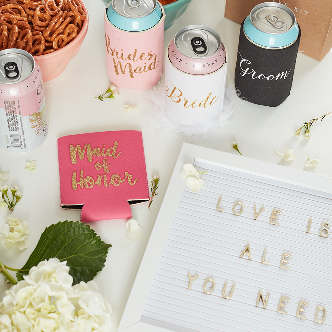 Beer wedding accessories with koozies and 'Love is Ale You Need' letterboard sign