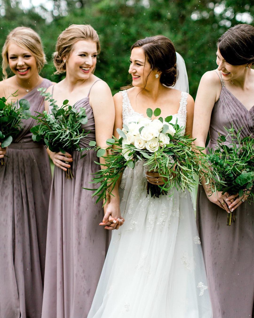 Bridesmaids holding bouquets made of leafy greenery | Nontraditional Wedding Bouquet Ideas