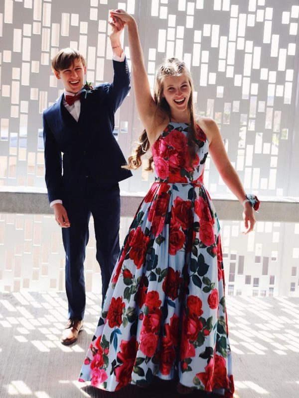 Boy twirling girl in long floral print prom dress from David's Bridal | Prom 2019 Dress Ideas