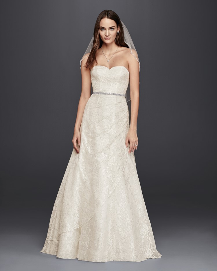 Bride in strapless lace A-line wedding dress from David's Bridal's affordable wedding dresses assortment