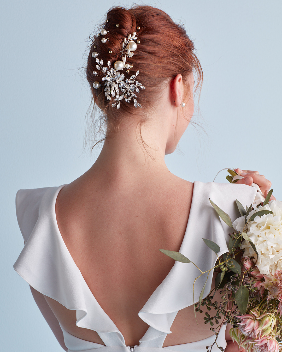 French twist wedding hairstyle with pins and clips