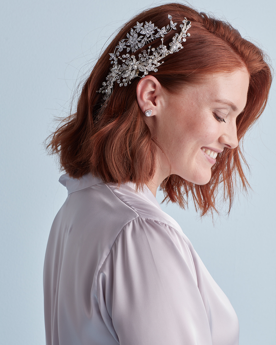 Down wedding hairstyle with layered clips