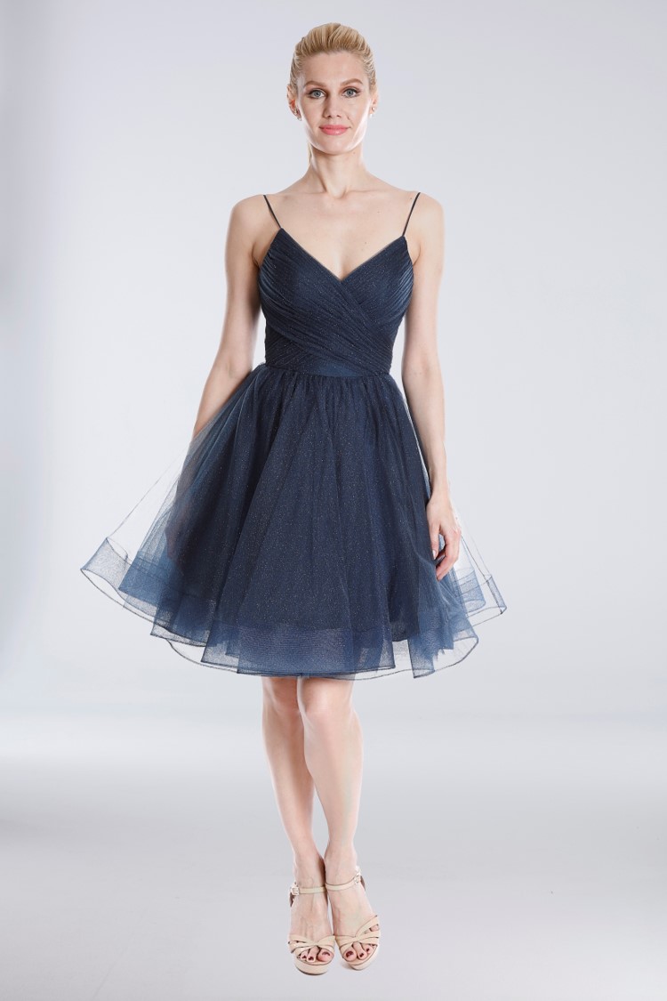 Girl in short blue tulle glitter homecoming dress