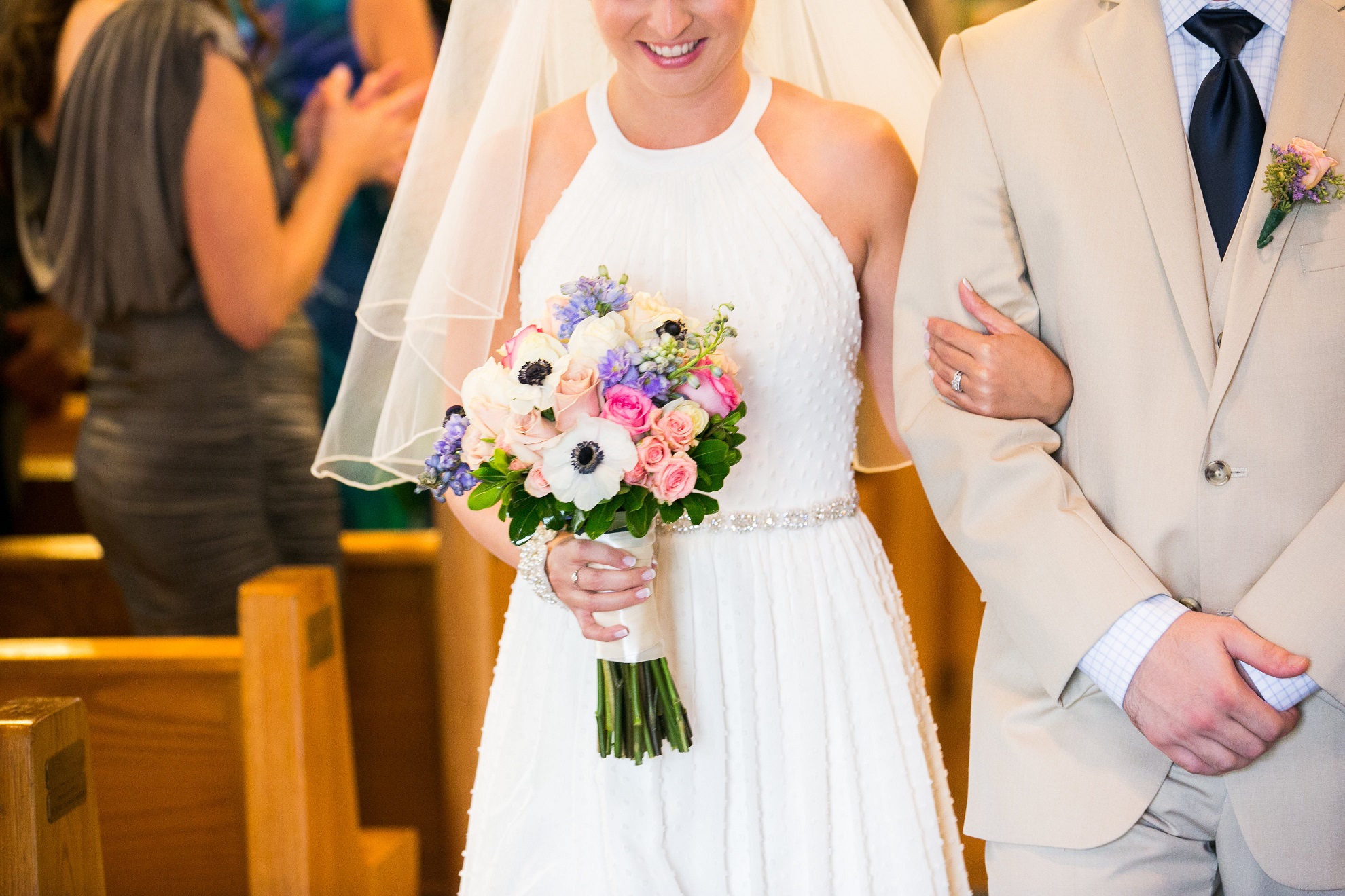 Close up shot of bride holding bouquet