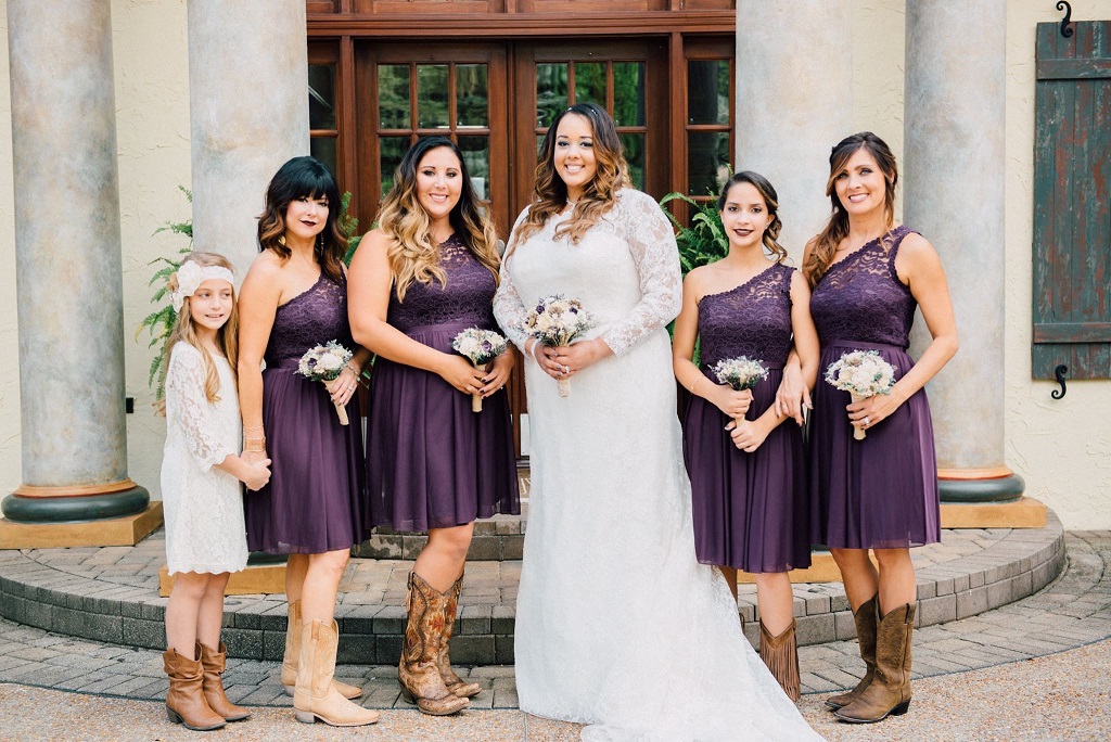 Bride Courtney with her bridesmaids in cowboy boots