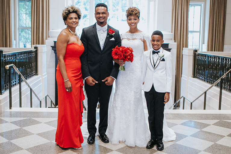 Bride and Groom with Family wearing black, white and red