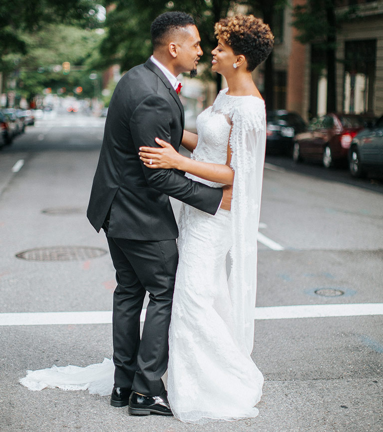 Bride and groom dancing in the city streets of Richmond, VA.