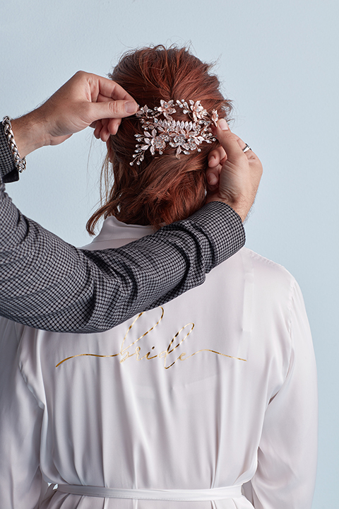 Hair stylist adding clip to hair