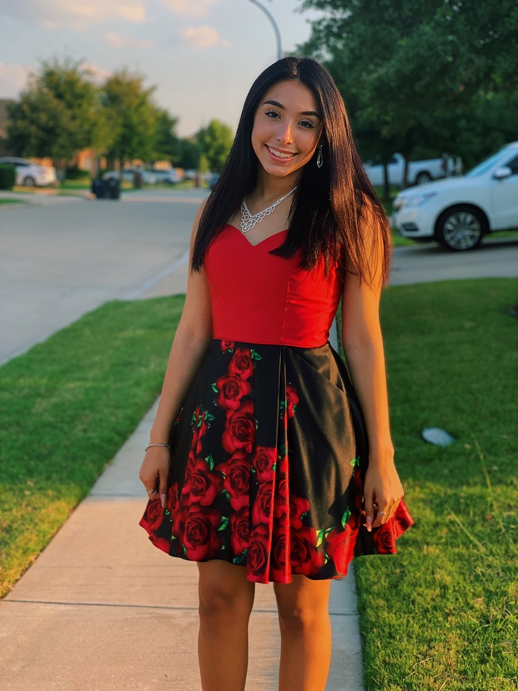 Girl in short red and black rose homecoming dress