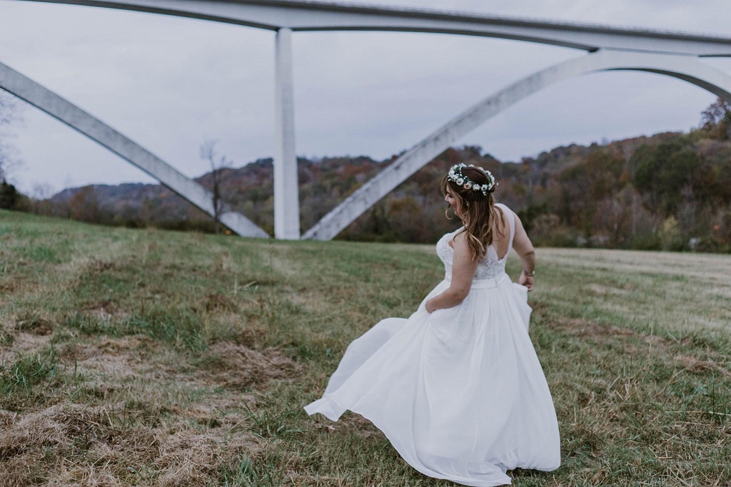 Real bride Jaymee twirls in her David's Bridal dress. 