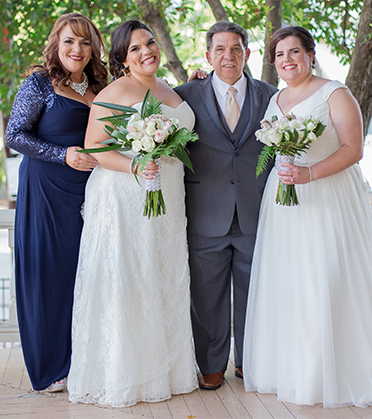 Two brides with their parents. 