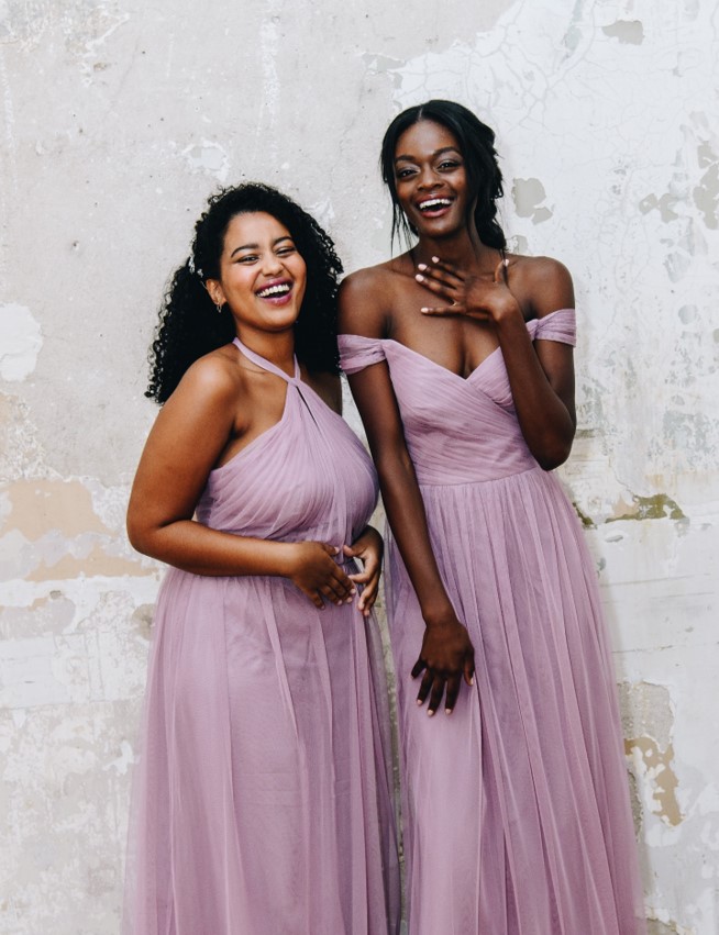 two bridesmiads in long quartz colored dresses