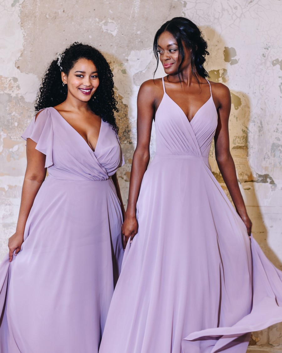 two bridesmaids in lavender wrap dresses