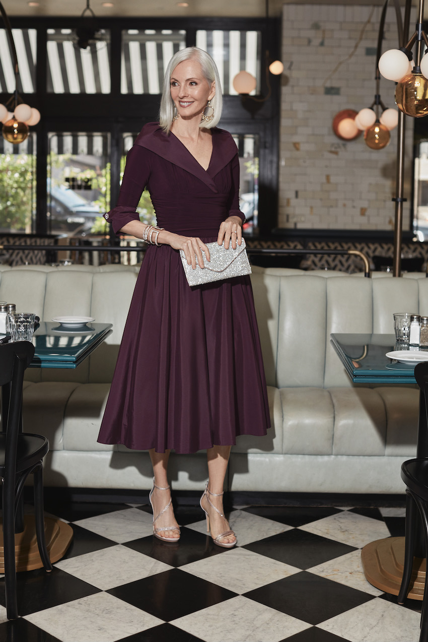 Mother of bride in a tea length purple dress