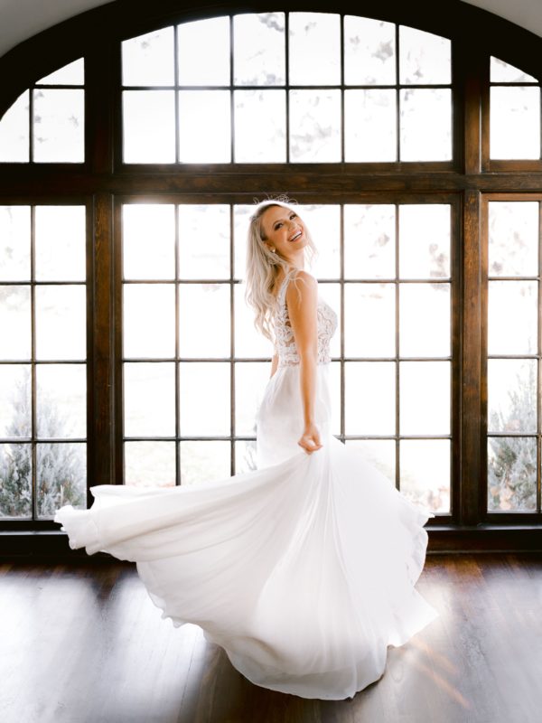 Bride twirling in dress