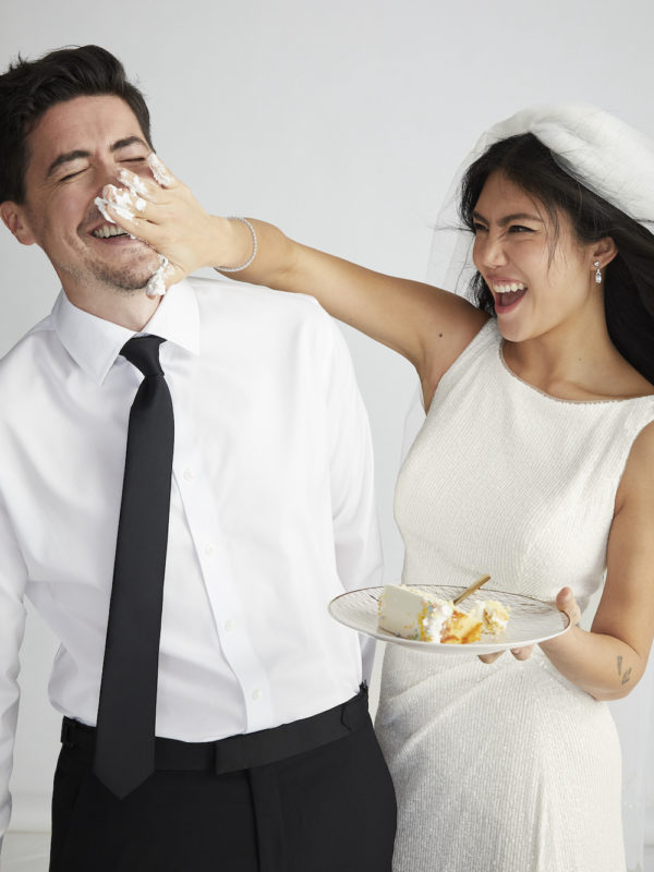 Bride and groom eating cake