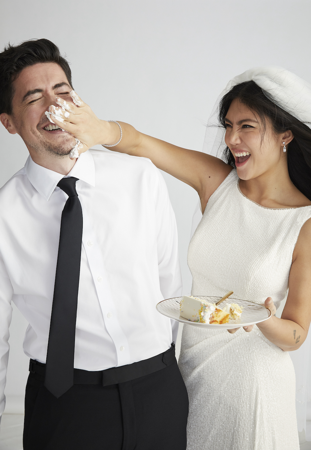 Bride and groom eating cake