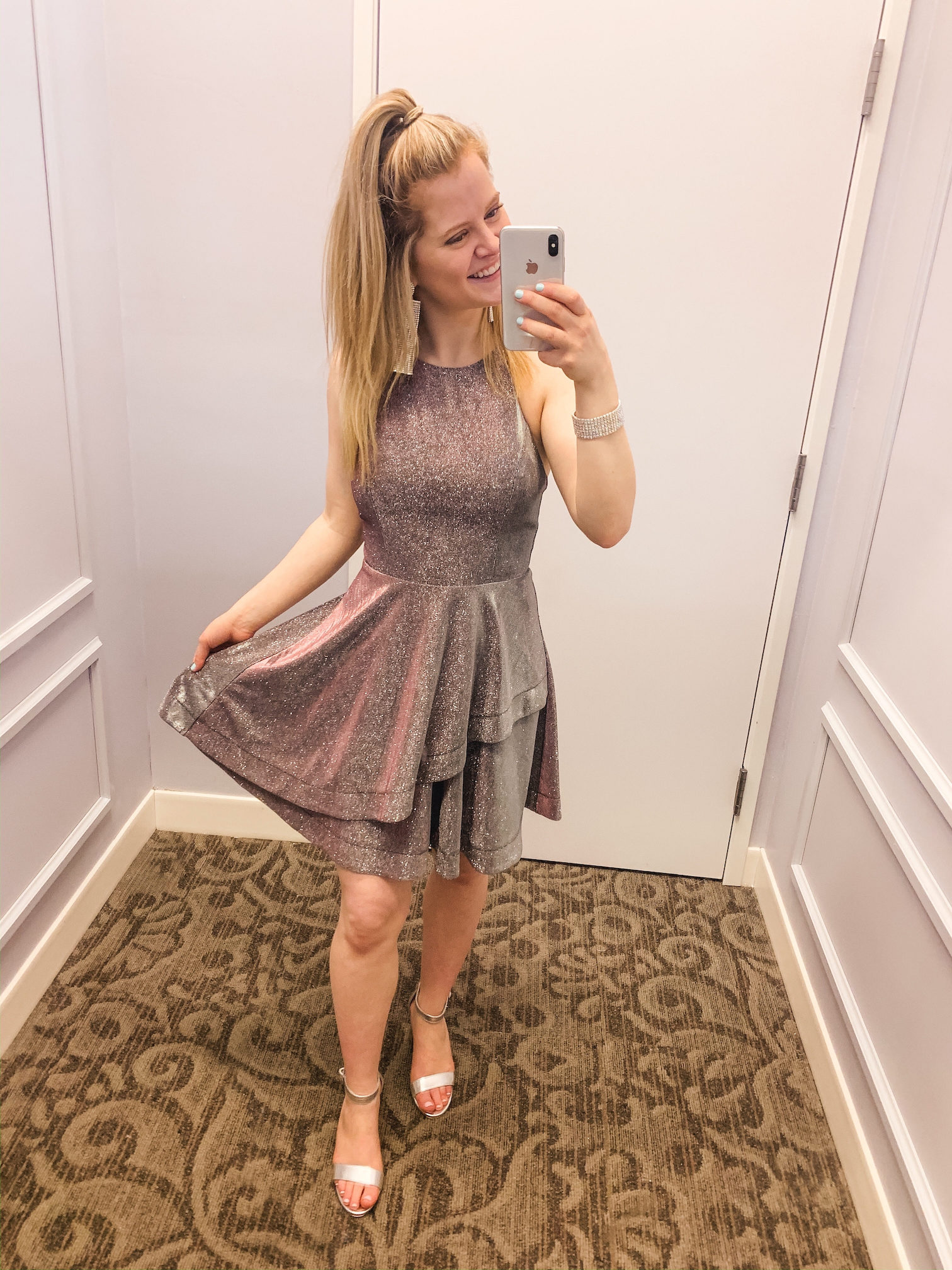 Mirror photo of girl in short prom dress