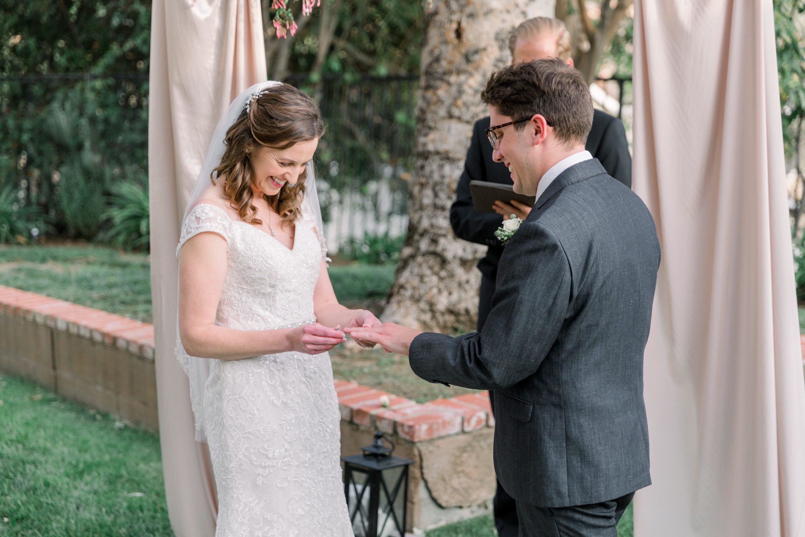 Bride and groom exchanging rings