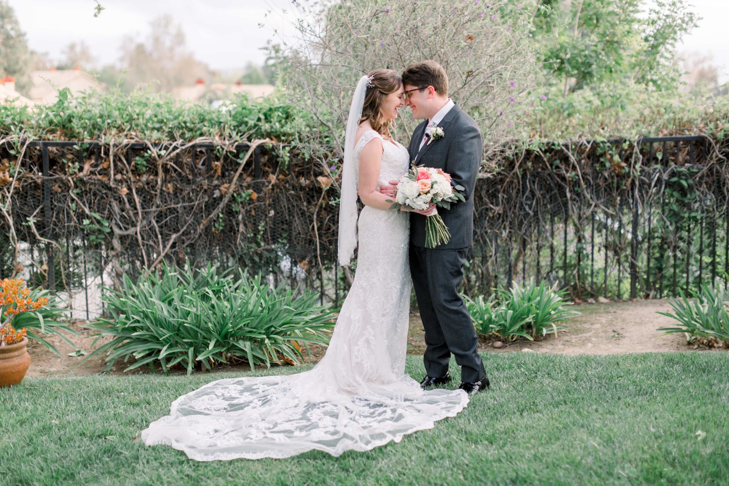 Bride and Groom embracing in backyard wedding