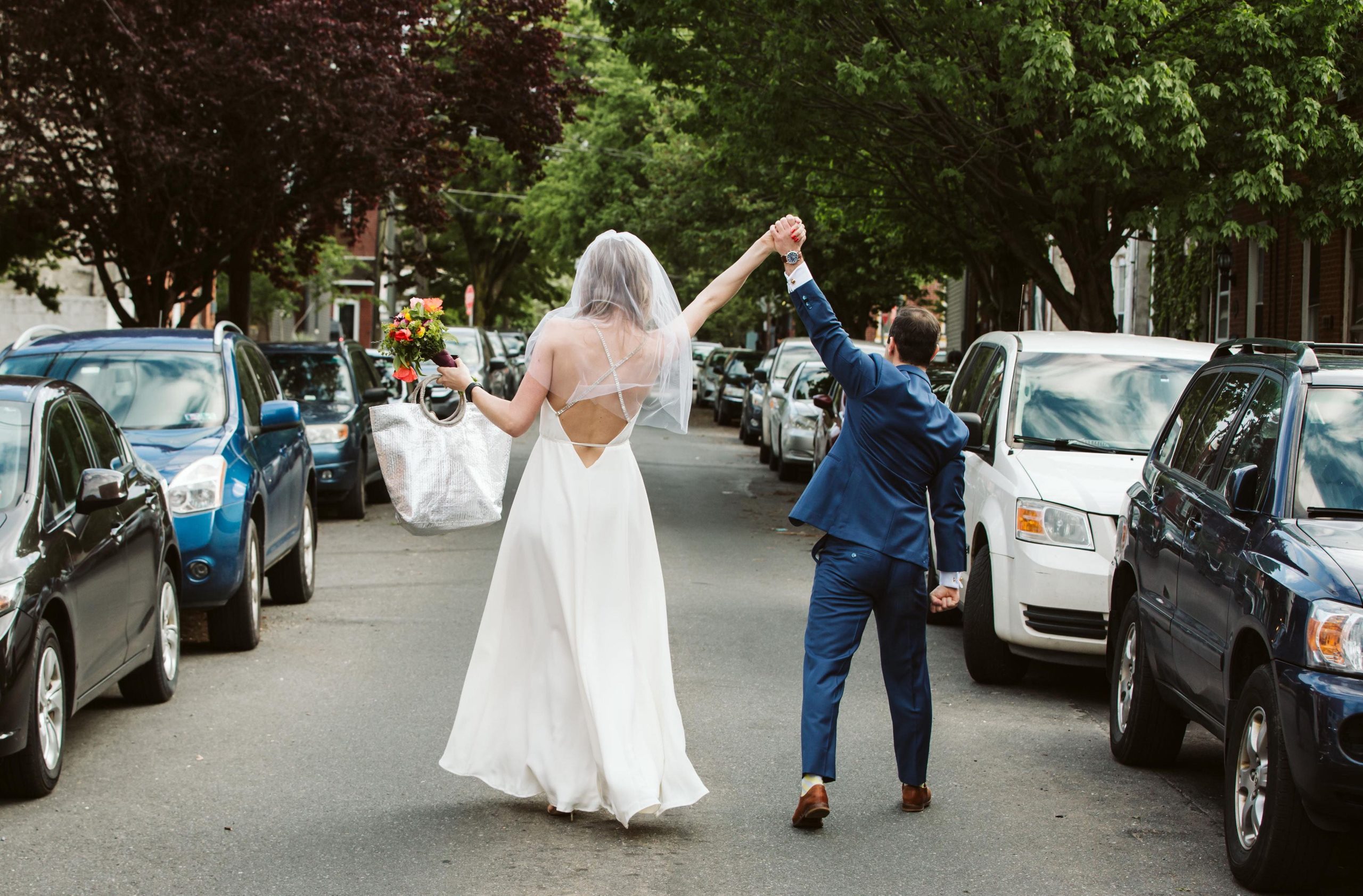 Jordan and Steve holding hands in the streets of Philadelphia