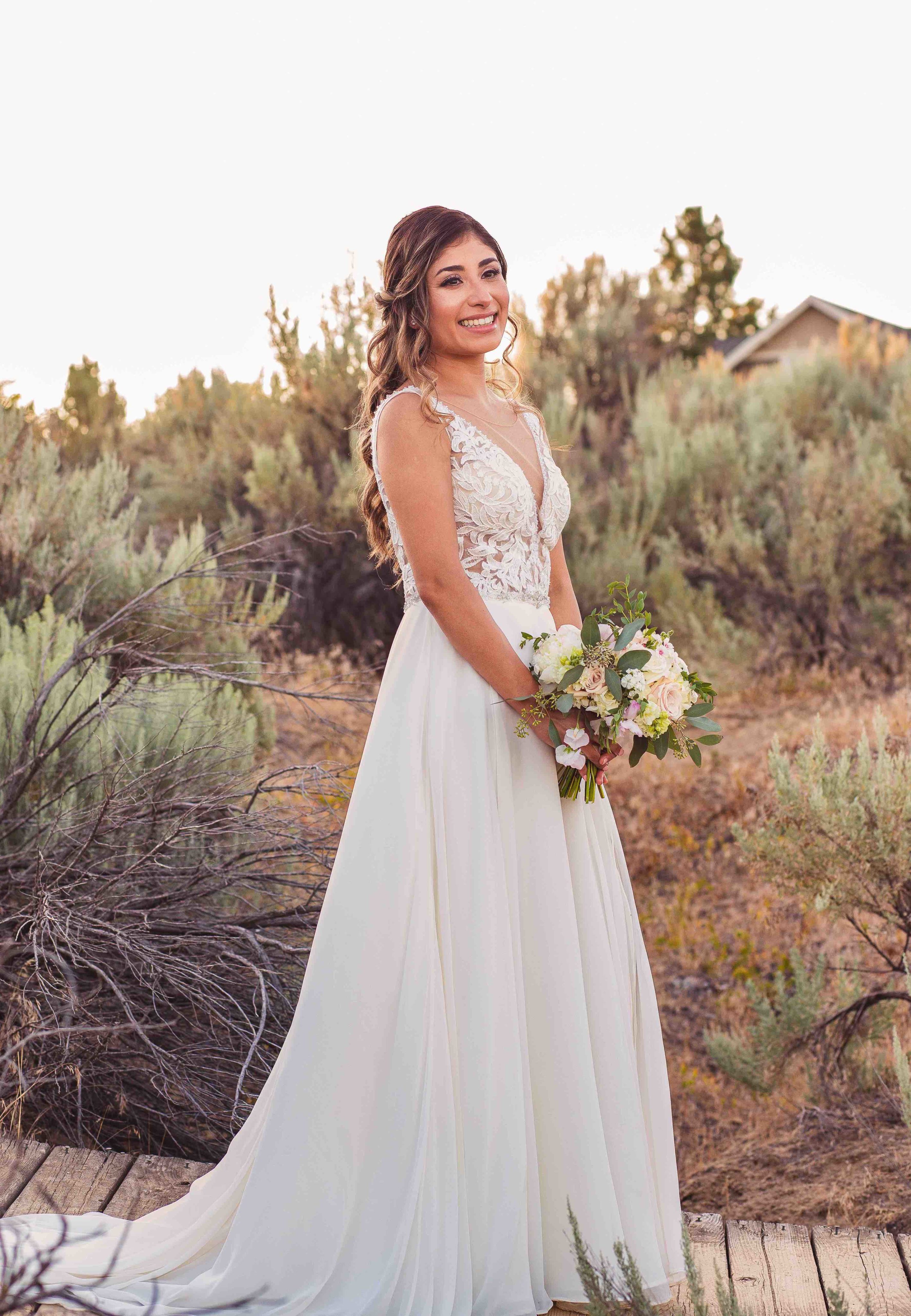 Solo shot of bride holding bouquet