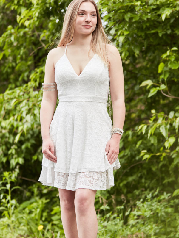 teen wearing white lace party dress