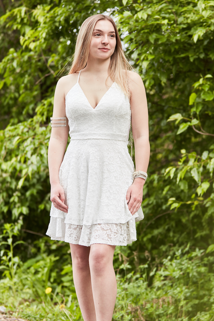 teen wearing white lace party dress