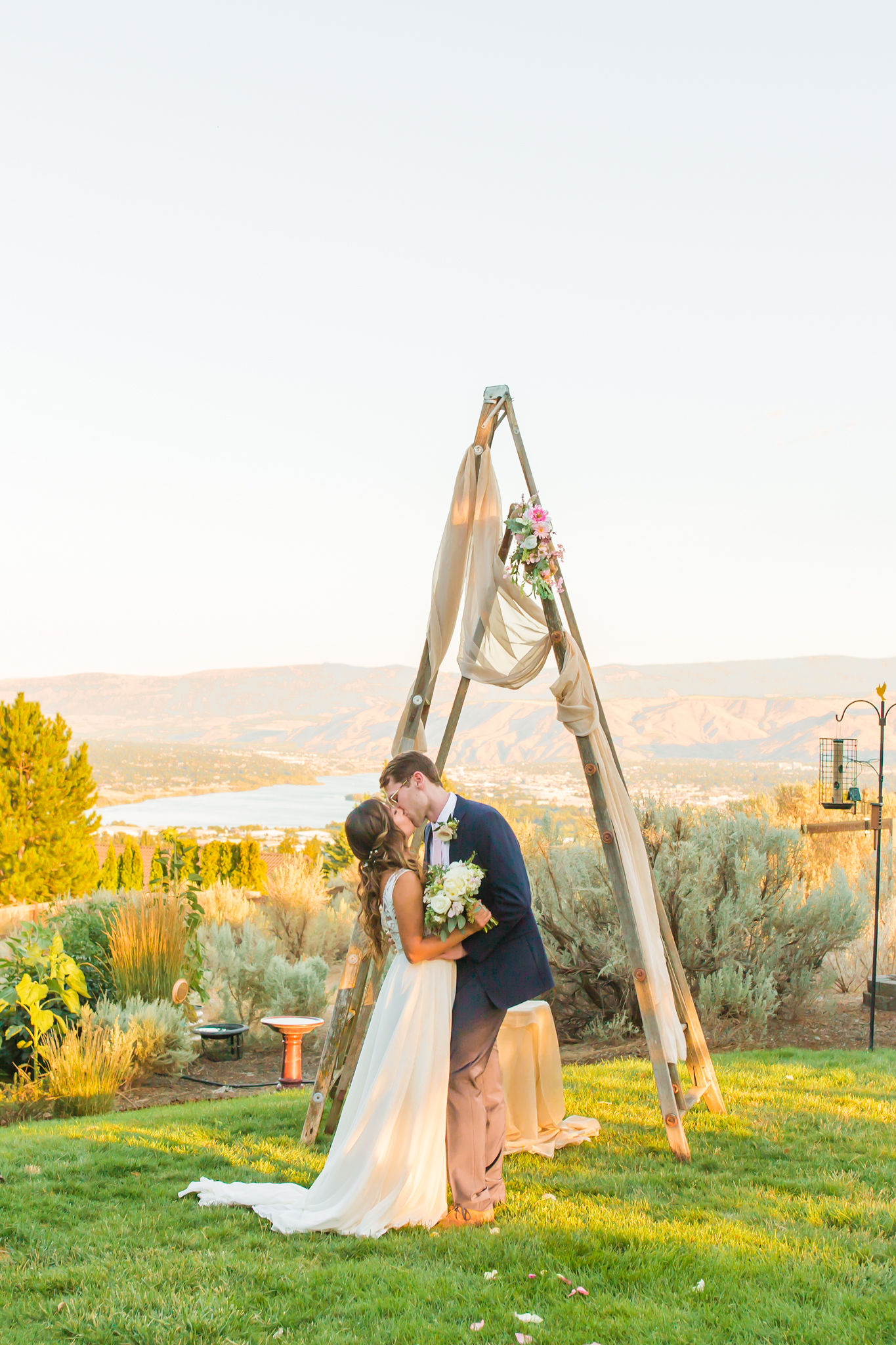 Bride and groom sharing first kiss