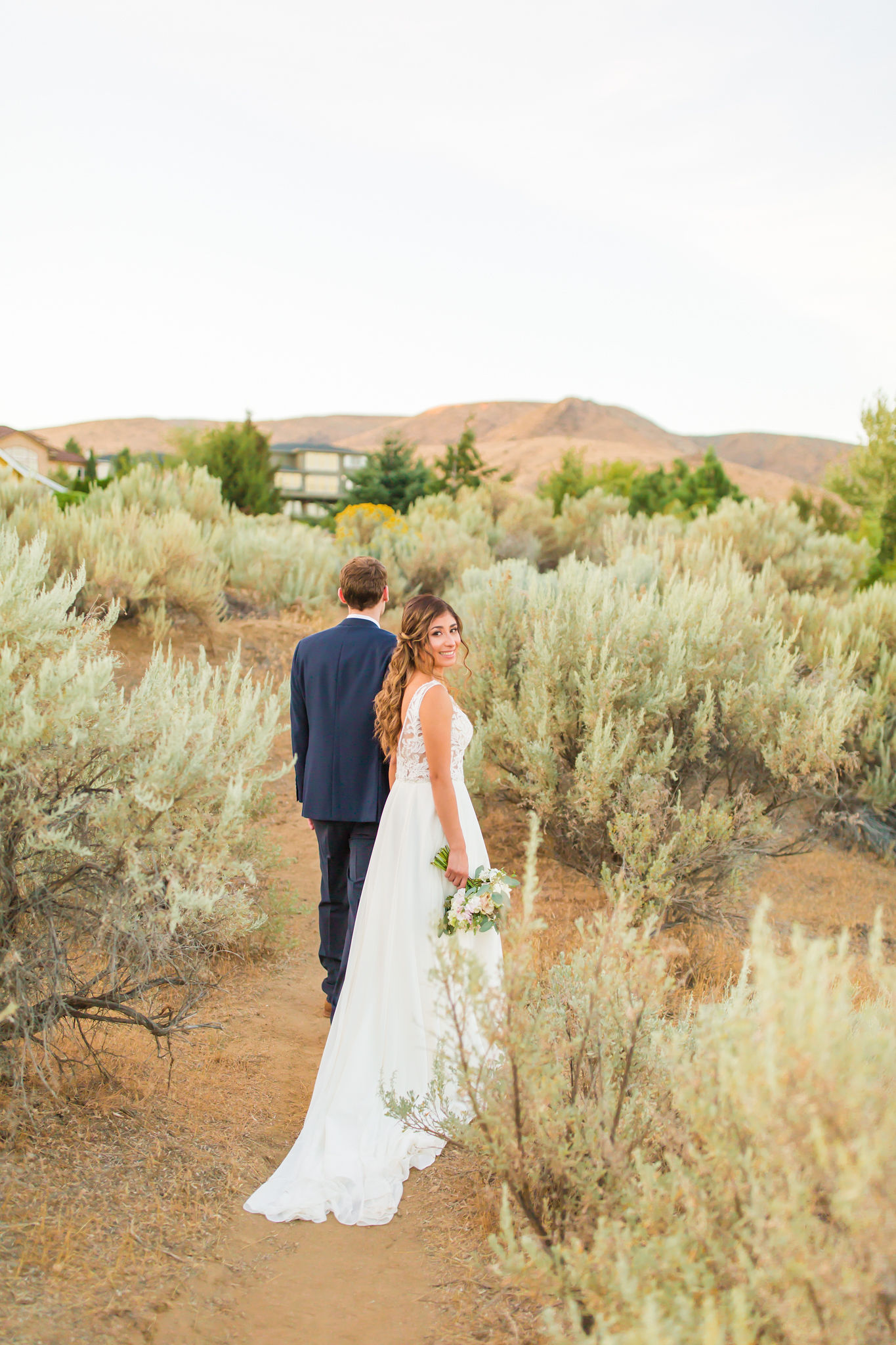 Bride and groom holding hands