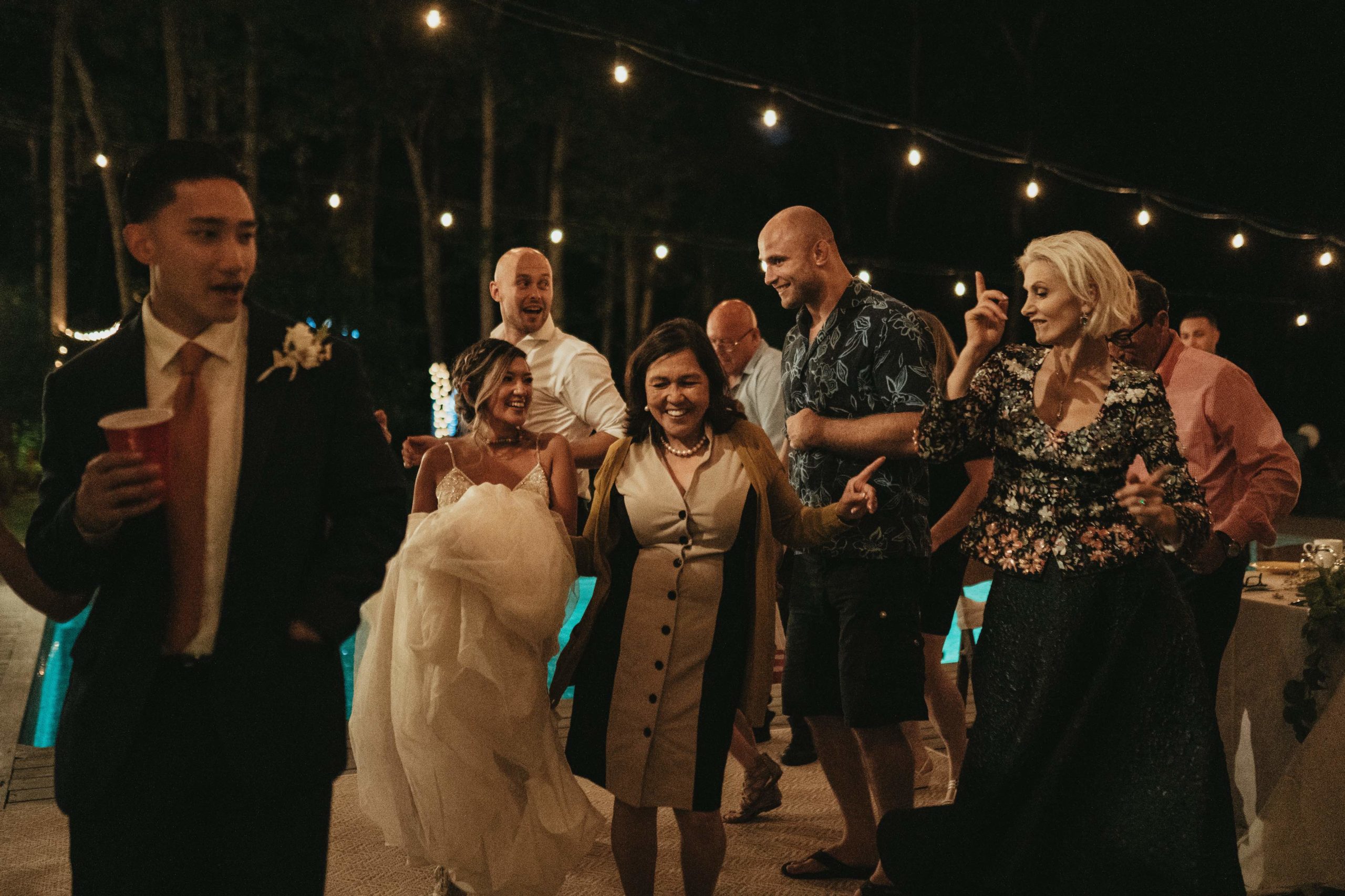 Family dancing at night
