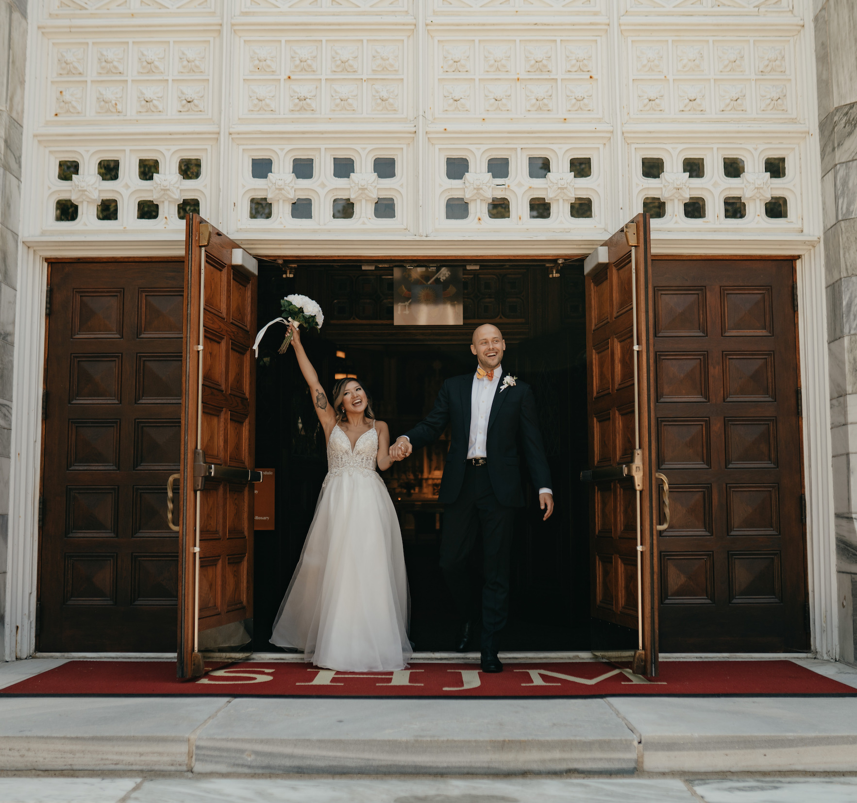 Bride and groom leaving ceremony as newlyweds