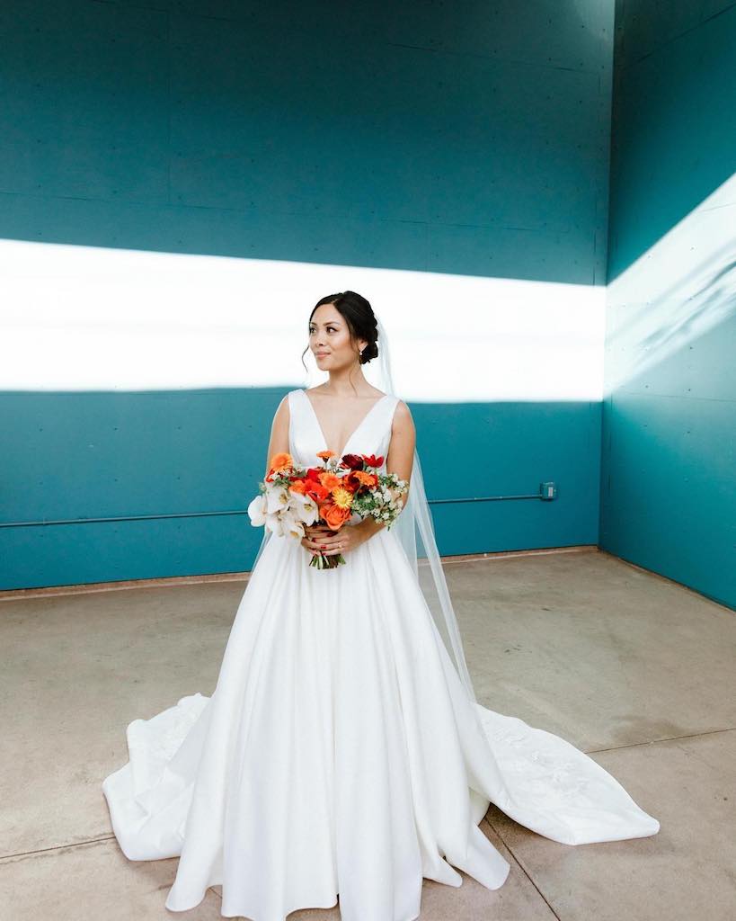 bride wearing all satin ball gown