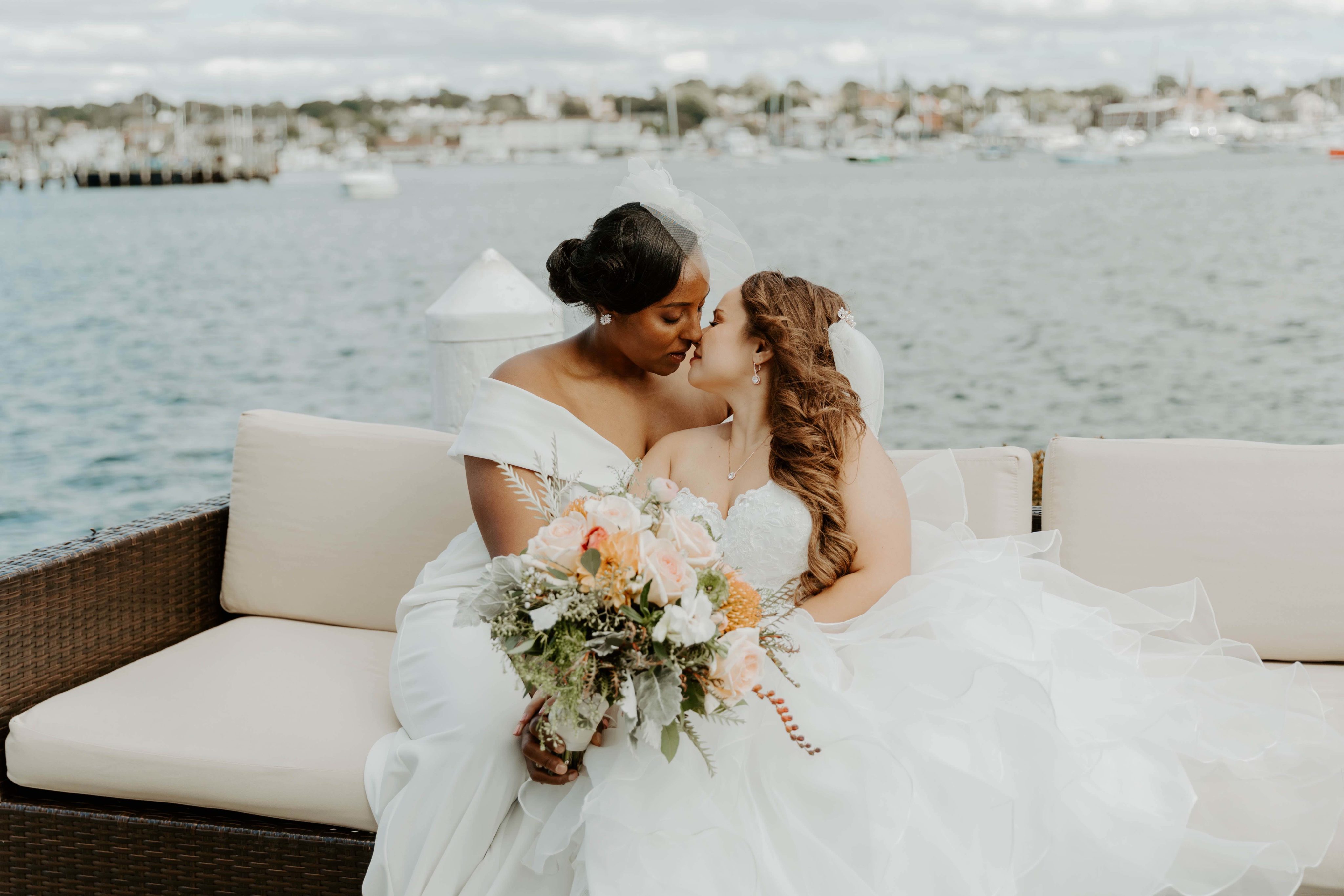 Kristina and Kindell kissing on dock