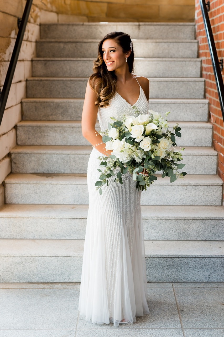 Solo shot of bride holding bouquet