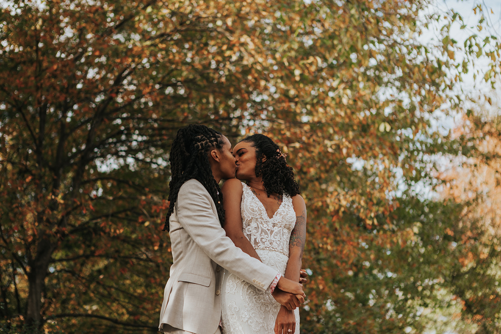 Brides Kira and Noel Kissing