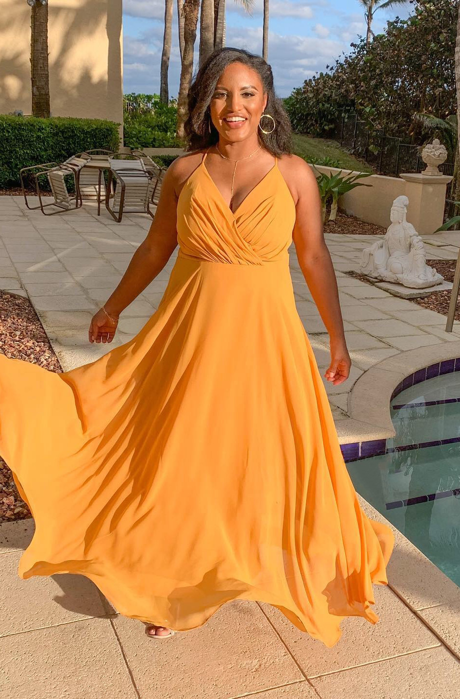 bridesmaid wearing marigold colored bridesmaid dress