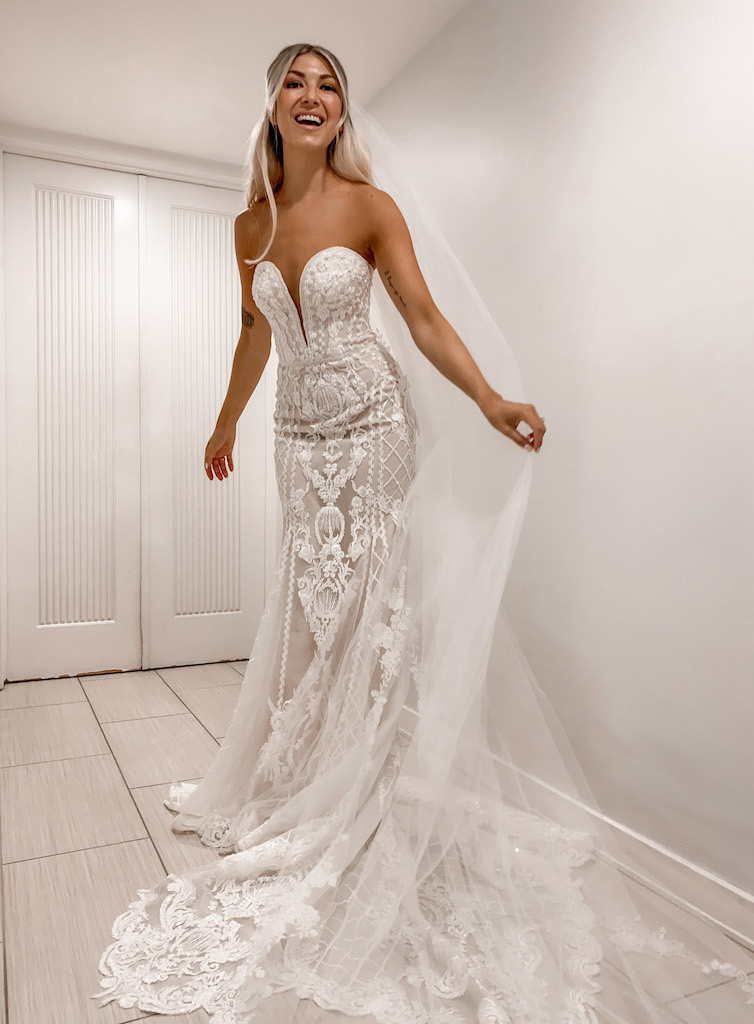 bride wearing a mermaid silhouette gown with intricate lace appliques