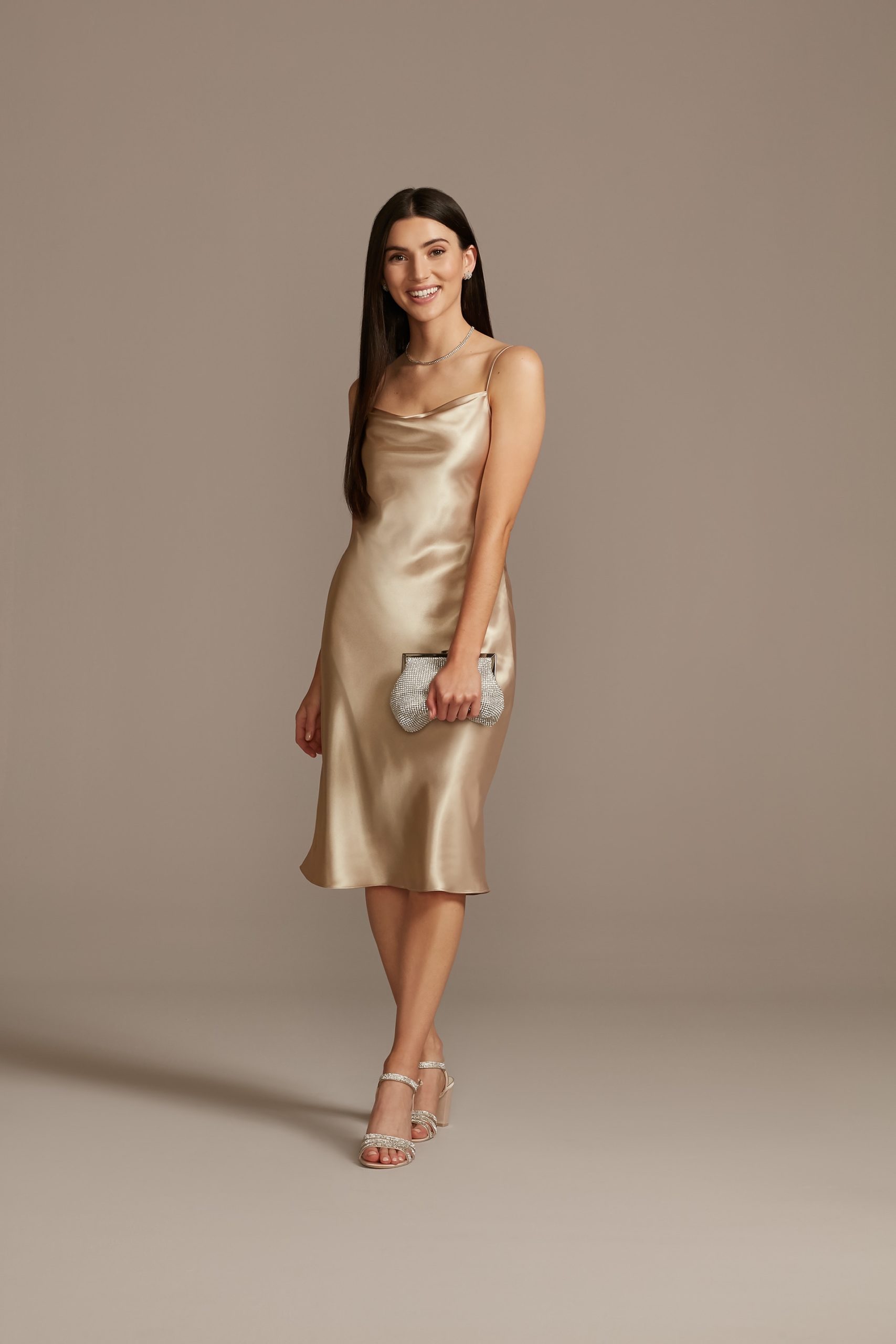 girl wearing gold satin slip dress