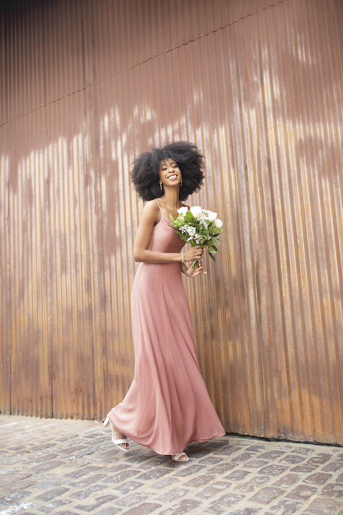 girl in long pink bridesmaid dress
