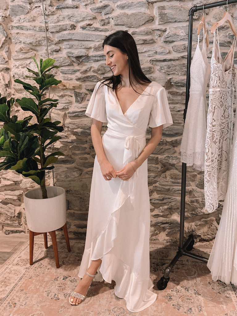 bride in satin white high-low wrap dress