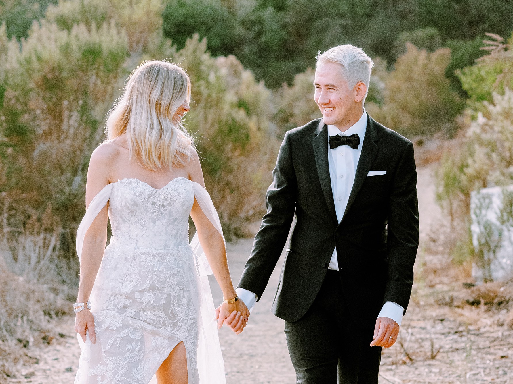 Couple Holding Hands in lush Los Angeles greenery