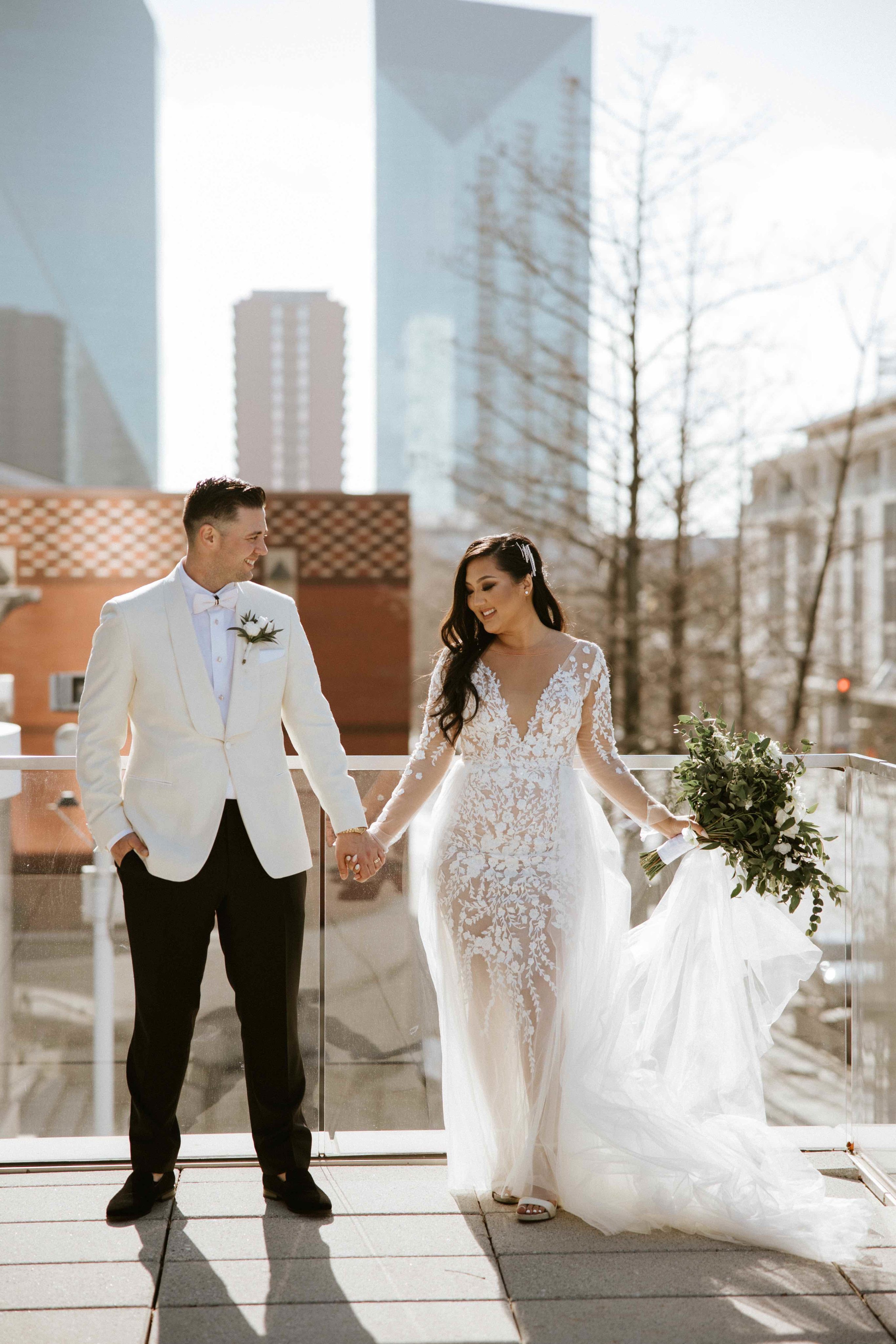 Bride and groom holding hands